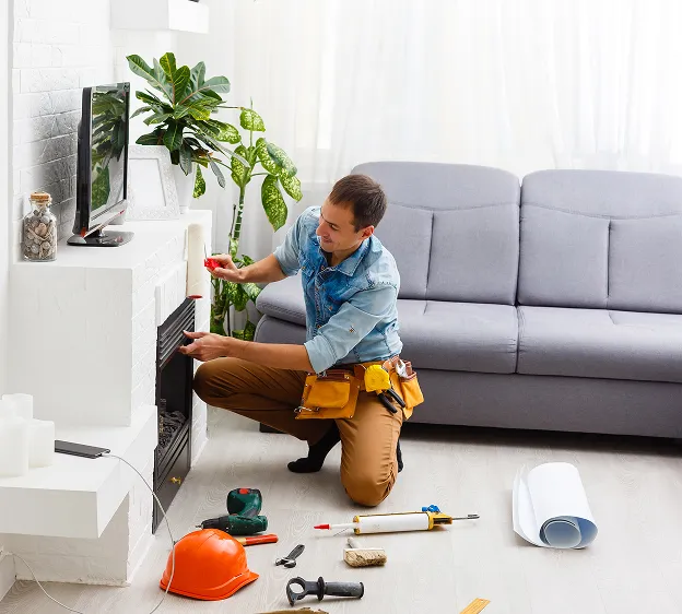 Homme installant une cheminée à Chambray-les-Tours près de Tours en Indre-et-Loire 37.